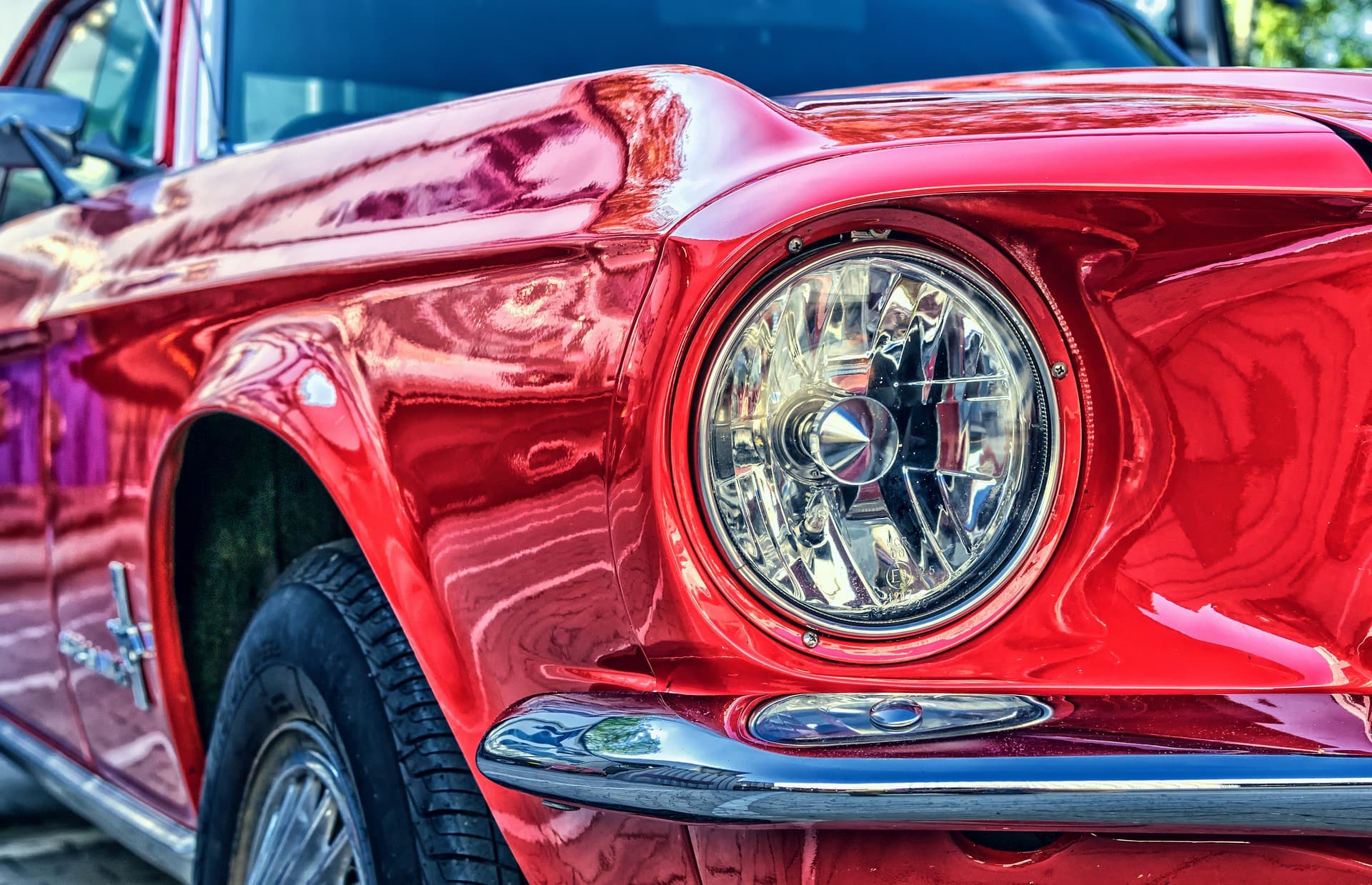 close-up of the front grille of red mustang